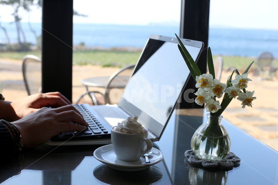 male hand,occupation,cappuccino,laptop,holiday,Beach,computer,coffee cup,vacation,leisure,keyboard,rest,Table,business,work,sea view,cappuccino cup,flower,cafe,person,coffee,travel,male,internet