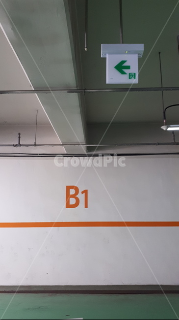 green,emergency exit,underground parking lot,sign,B1