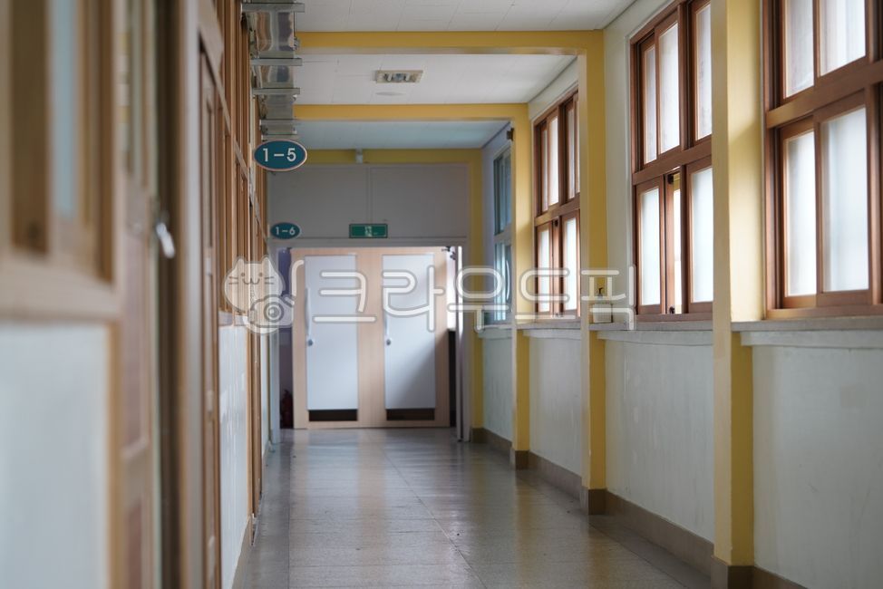 corridor,sign,classroom,inside,building,number,school,wood,window,by the window,architecture
