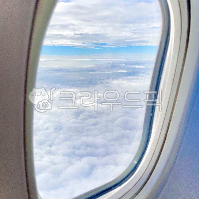 cloud,airplane window,clear sky,window,Inside the plane