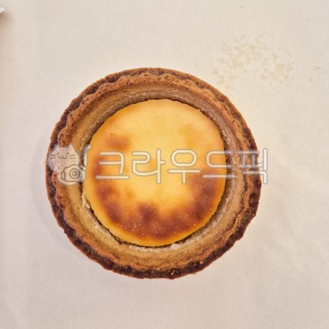 bread,dessert,bakery,snack,custard,food,egg tart