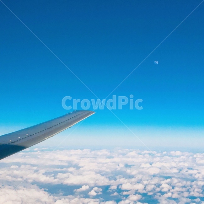 cloud,sky,outside the plane,airplane,above the clouds