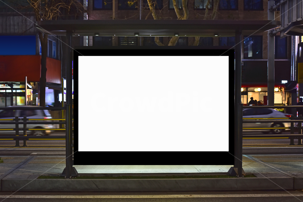bus stop,commercial,electronics,sign,screen,standing signboard,building,empty,empty space,projection screen,backdrop,mockup image,night,billboard,background,person,projectionscreen,frame,signboard,information board,blank,city,commercial advertisement,outd
