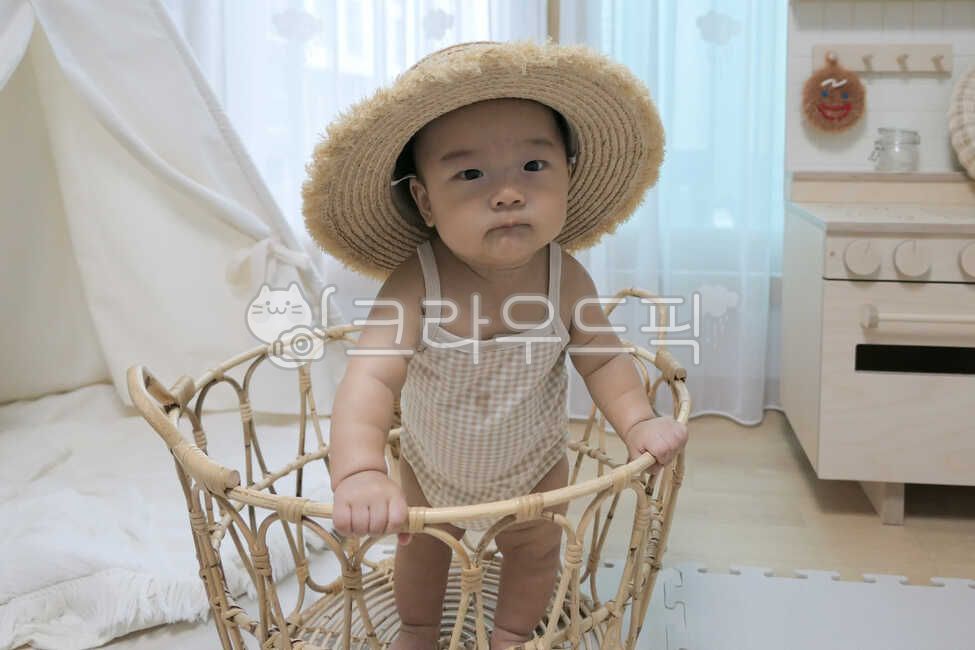 baby model,small,tent,facial expression,rattan basket,rug,young,held,playroom,innocent,0 year old,rattan,Basket,mothers arms,infant,pure,cute,one year old,straw hat,life,interior,son,angelic,hat,baby tent,human,parenting,lovely,precious,newborn,1 year old