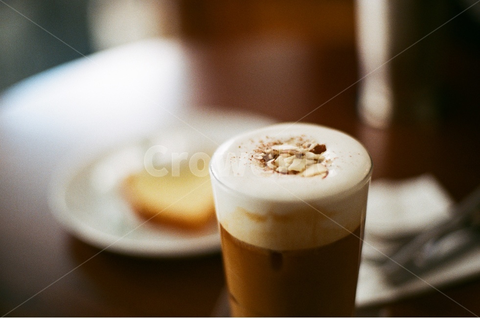 Cafe Latte,plate,Latte,delicious,Emotional photo,film photography,analog,cafe,whipping cream,coffee,table,iced coffee,cup,glass cup