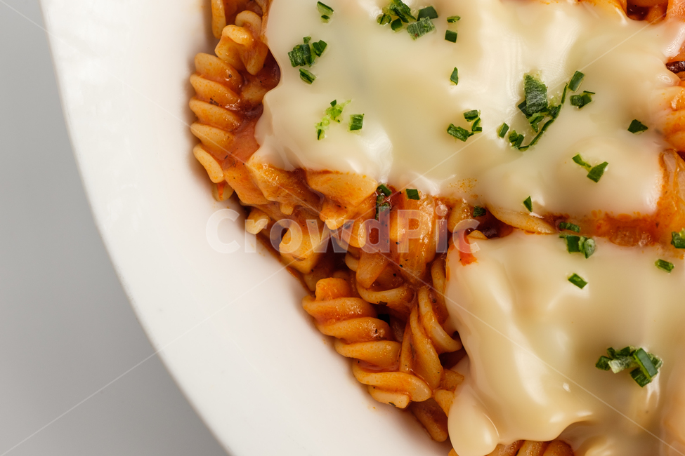 Italian culture,short pasta,Italian food,savory,tomato sauce,snack,onion,noodle,tomato,fusilli,bowl,vegetable,delicious,food,cheese,Herb,meal,pasta,Twisted Twist,Cheddar Cheese