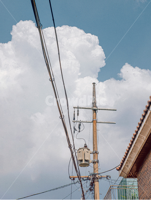 sky,cloud,wire,telephone pole,telegraph pole,electricity,clouds,electric cord