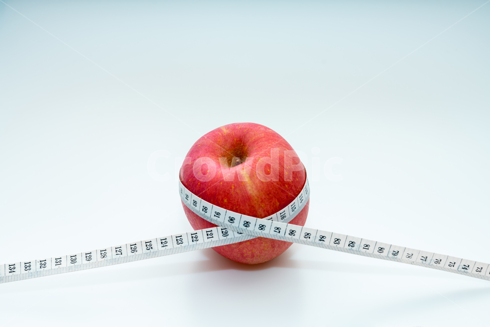 fruit,snack,idea,concept,crops,measurement,red,apple,measurer,wellbeing,diet,organic,raw fruit,Health,delicious,vitamin,food,plant,tape measure,fresh,adverb,object