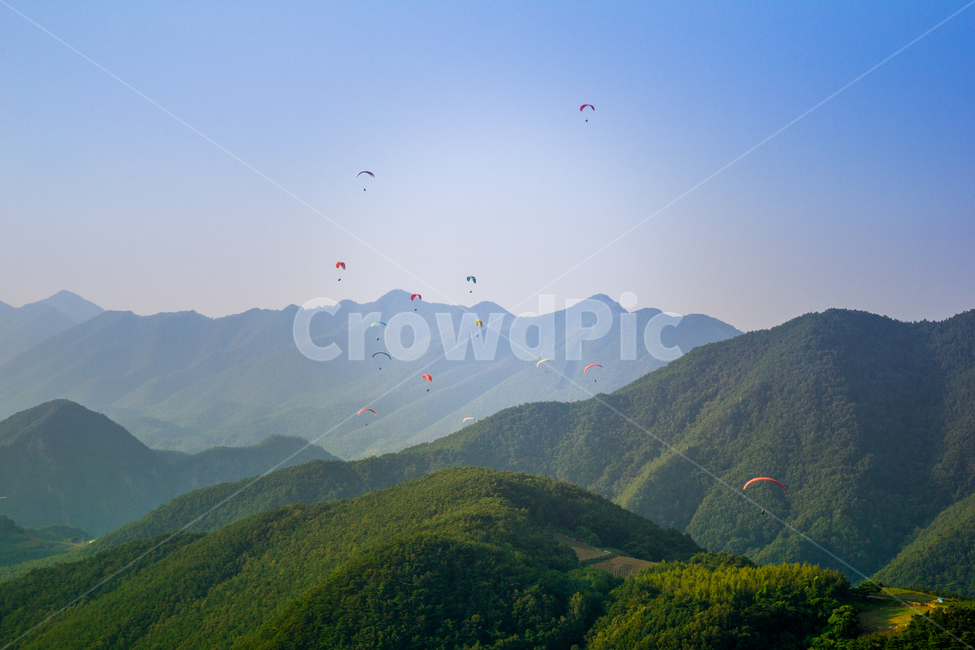 sky,mountain peak,forest,Landscape,nature,scenery,summer,healing,parachute,mountain,paragliding,blue,background,vacation,travel,leisure,sport,wind