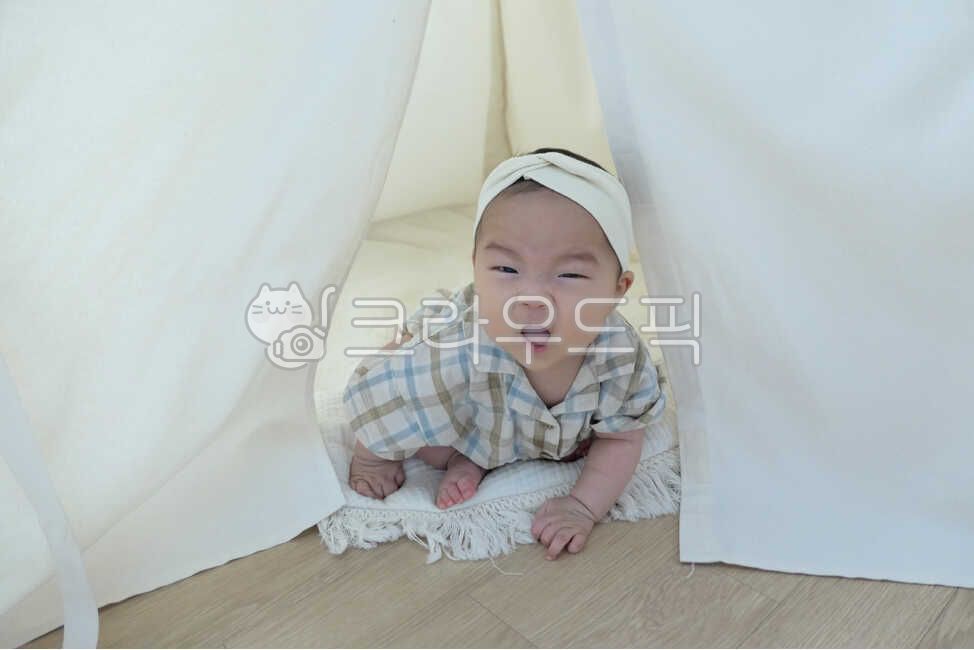 small,infant and toddler,young,0 years old,Indian tent,cushions,mothers arms,cute,one year old,eyes,life,tents,interior,smile,son,happiness,joy,angelic,rugs,dolllike,human,parenting,nose,lovely,precious,expression,playrooms,cradle,Baby,newborn,room,1 year