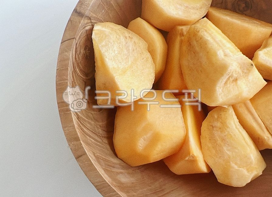 fall fruit,Fall seasonal fruits,sweet persimmon,fall food,fruit,persimmon,Shaved persimmon,wooden bowl,wood ball