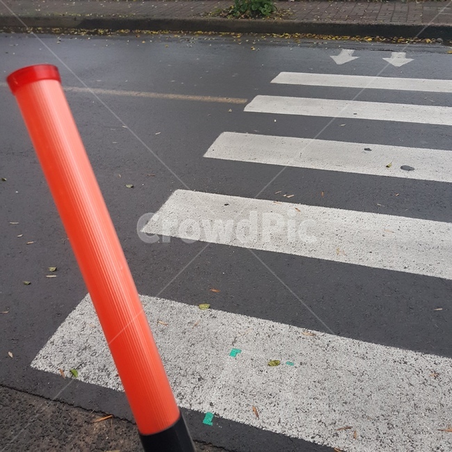 crosswalk,road name,asphalt,pole,traffic safety