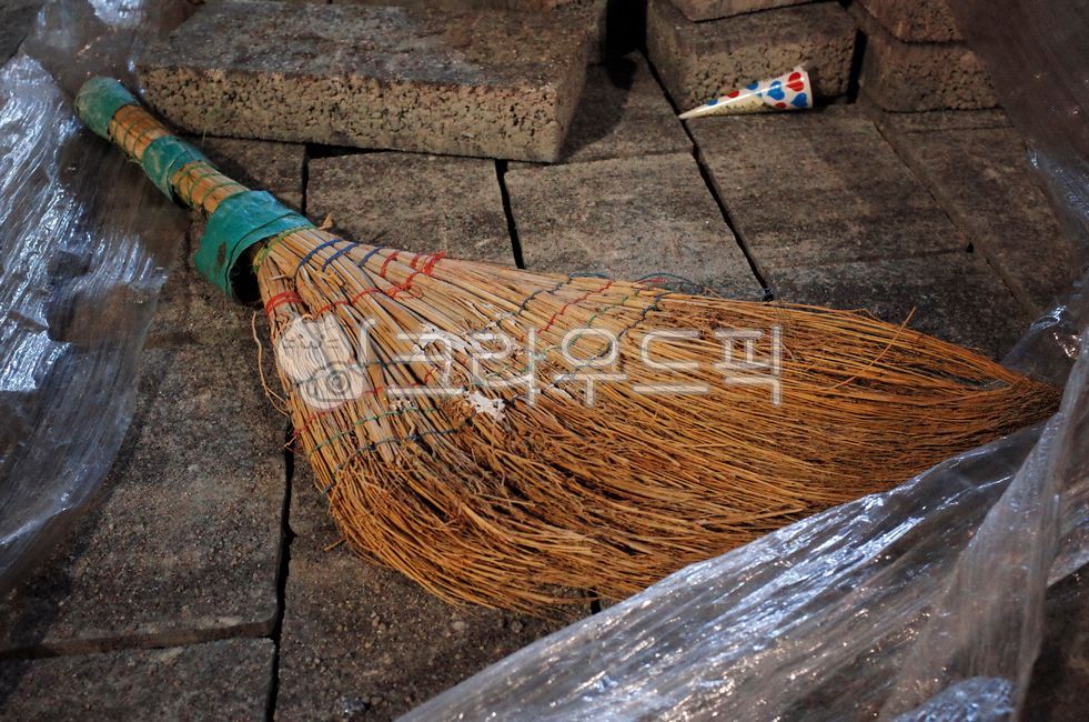 broomstick,old,broom,laid down,brick,abandoned,floor