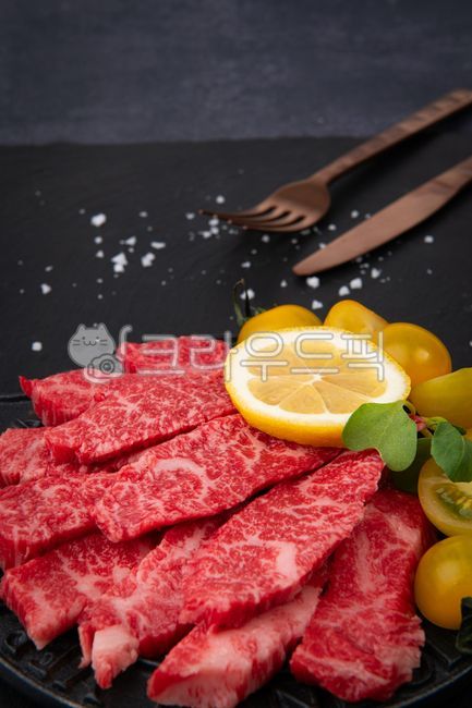 raw meat,beef,special cuts,meat,plate,cutting board,food,marbling,Korean beef,skirt steak,sirloin,fresh,black,background,lemon,tomato,frying pan,griddle,close-up,knife,salt,fork