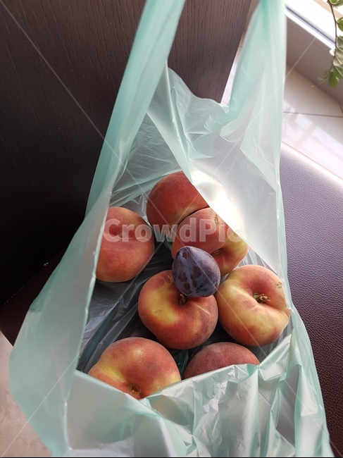 plum,flat peach,fruit,peach,plastic bag,europe