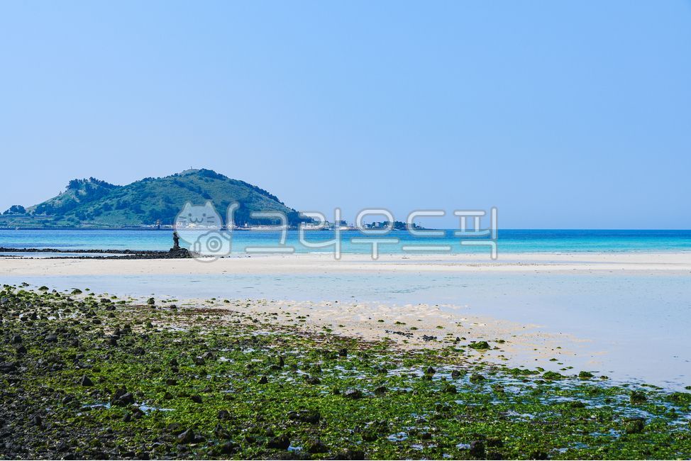blue sky,stone moss,coastline,emerald color,nature,island,waterweed,water,sea,sand,outdoors,ocean,shoreline
