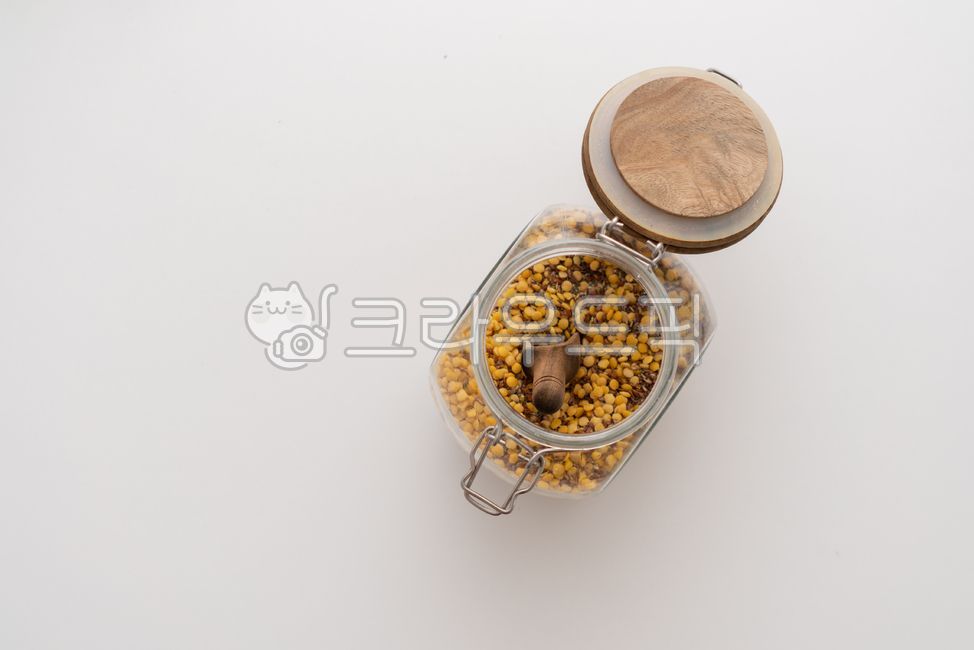 Grain,glass bottle,yellow,grain,wood spoon,lentils