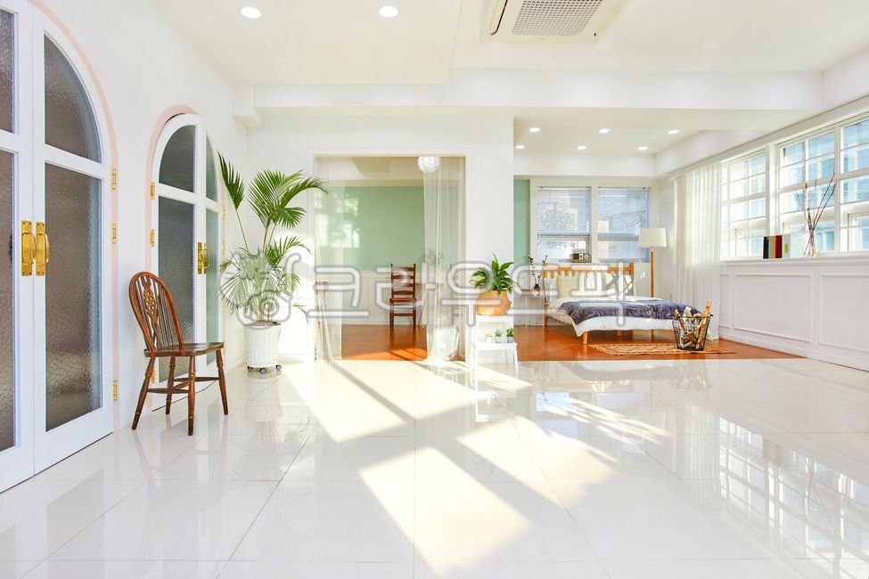 bed,studio,door,sunshine,woodenbed,couch,spacious living room,white wall,furniture,modern architecture,modernarchitecture,tree,It is comfortable,wooden bed,one room,light,comfortable,plant,interiordesign,indoor,curtain,arched door,flooring,rentalstudio,in