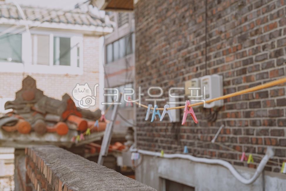 clothespin,clothesline,wood,wall