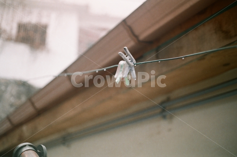 water drop,clothespin,clothesline,raindrop,film camera