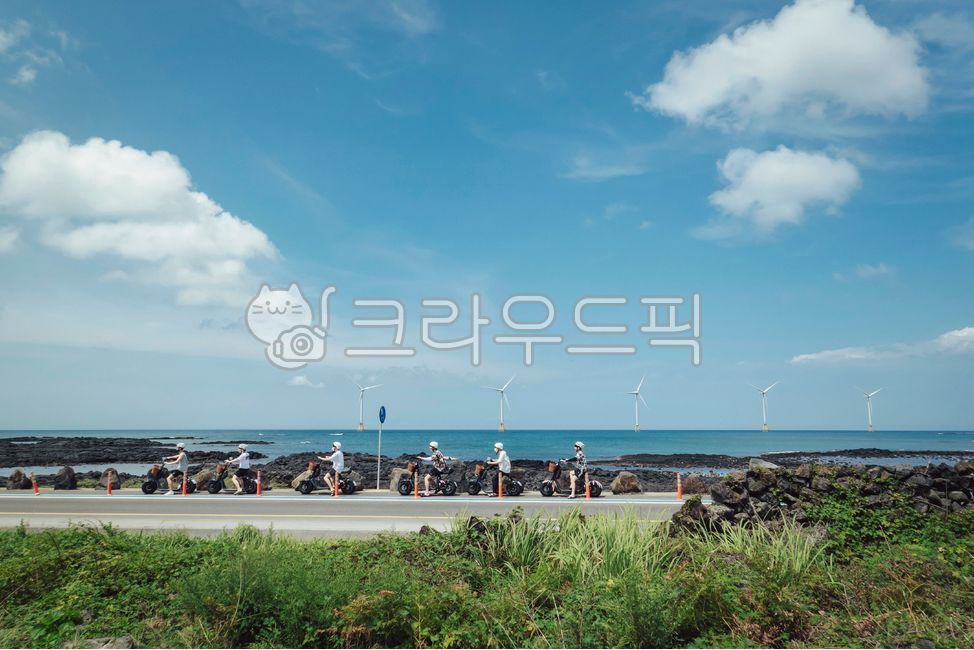 motor,Jeju,deck,wind turbine,jeju island,clouds,summer,cloud,engine,vacation,electric motorcycle,sky,turbine,nature,chair,wind generator,horizon,ocean,person,machine,stonewall,Sinchang Coastal Road,windturbine