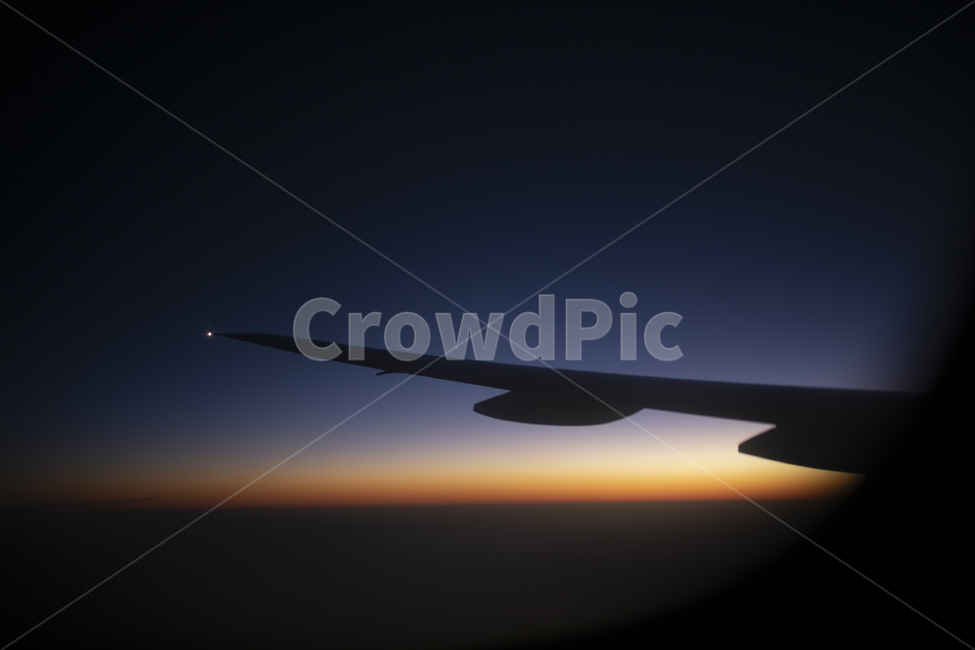 flight,evening glow,outside the plane,trip,business trip,Above the sky,vacation,traffic,afterglow,sky,nature,traveling,outdoor,airplane wings,airplane window,outdoors,airplane,sunset,silhouette,window,travel,wing,landscape