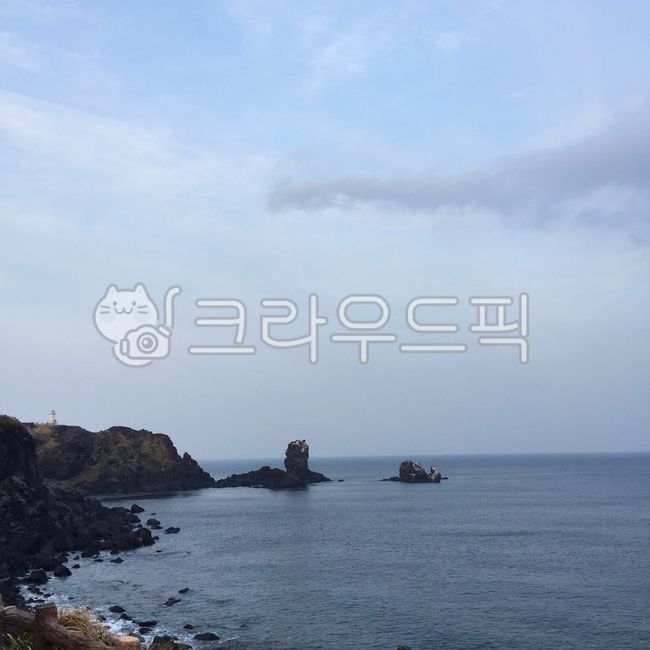 sky,headland,coastline,nature,water,sea,promontory,basalt,outdoors,ocean,shoreline