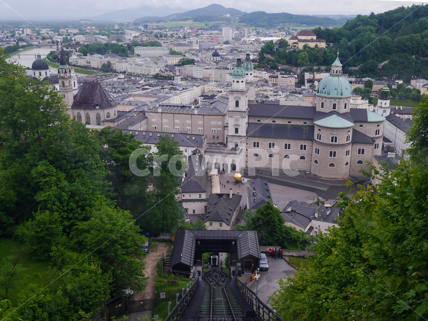 Eastern Europe,city,tourist city,Middle Ages,building,scene,funicular,cloud,mountain train,beautiful,Austria,dark clouds,baroque style,sight,incline,europe,mozart,travel destination,railroad,nature,cable car,rail,Salzburg,medieval city,slope,salzburg,tour