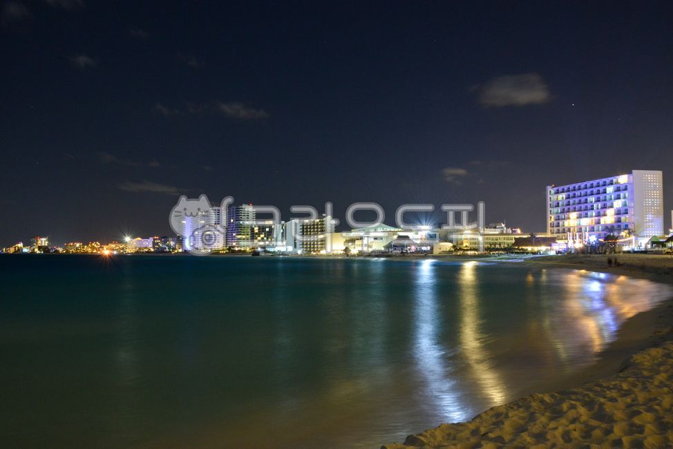night view,city,metropolis,center,water,building,cloud,Beach,ocean,outdoors,light,cancun,sandy beach,waterfront,Mexico,hotel,fire