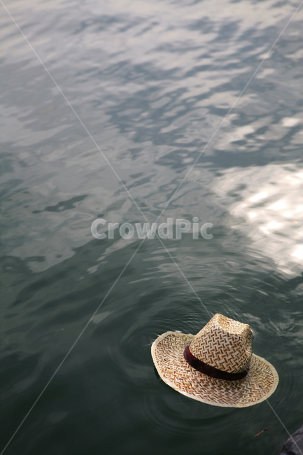 cowboy,cowboy hat,hat,river,straw hat,lake