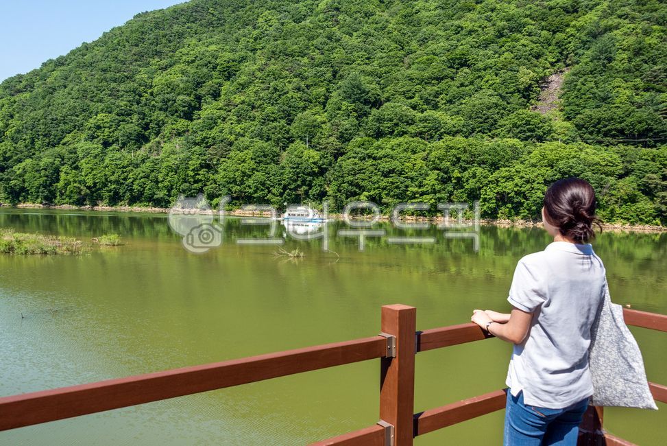 Dalcheongang,cruise ship,handrail,woman,tourist destination,ship,watercraft,banister,water,Goesan,Sanmagi Old Road,mountain,person,railing,female,human