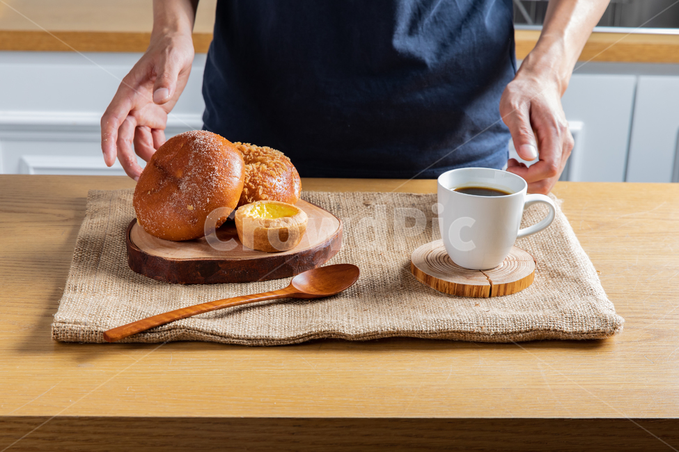 Sweet red bean bread,tablecloth,Meal,inside,interior,hungry,modern,coffee cup,neat,kitchen,table,hand,Woodenware,bread,tree,equipment,delicious,food,Lunch,Tray,pastry,spoon and chopsticks,White,mug cup,brunch,coffee,Spoon,organized,breakfast,sweet