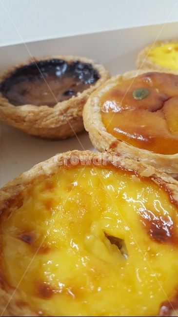 bread,dessert,tart,food,egg tart
