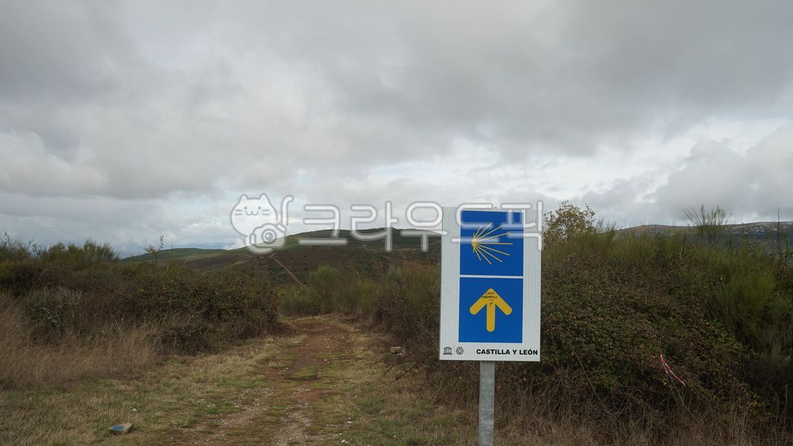 cloud,milestone,pilgrim path,sign,santiago,Pebble