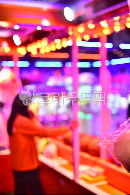 play,game,color,inside,Draw room,Arcade,light,glaring,joy,person,Doll claw room,fluorescent lighting,neon sign,female,Color full