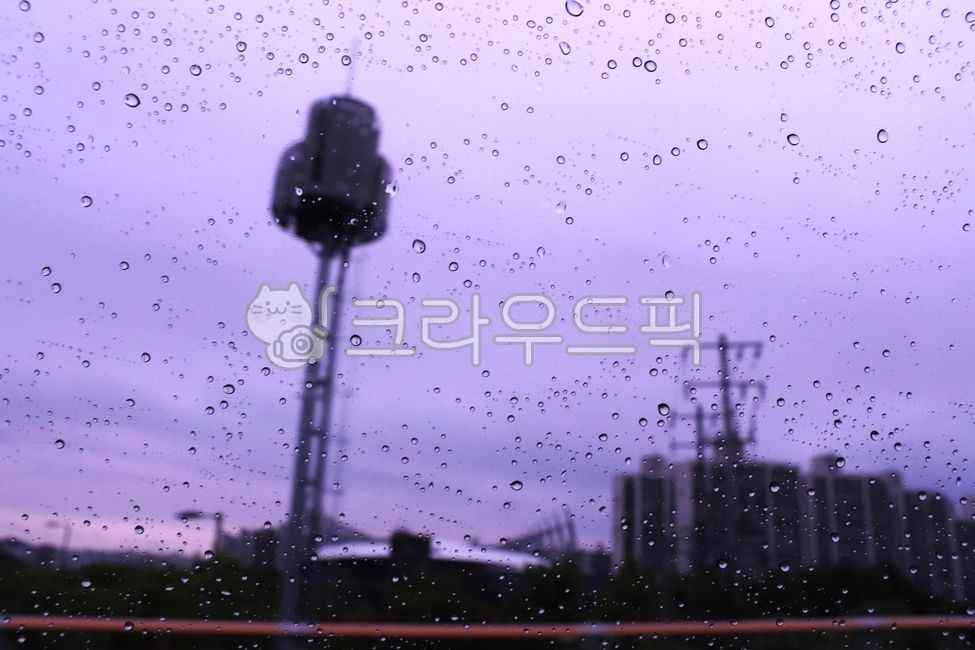 raindrops,window,purple sky,transmission tower,building,apartment,communication tower,cloudy weather,cityscape,rainy season,rainy day,rainy,rainwater,gray clouds,evening sky,humid weather,dark sky,industrial area,power facility,rainy sc