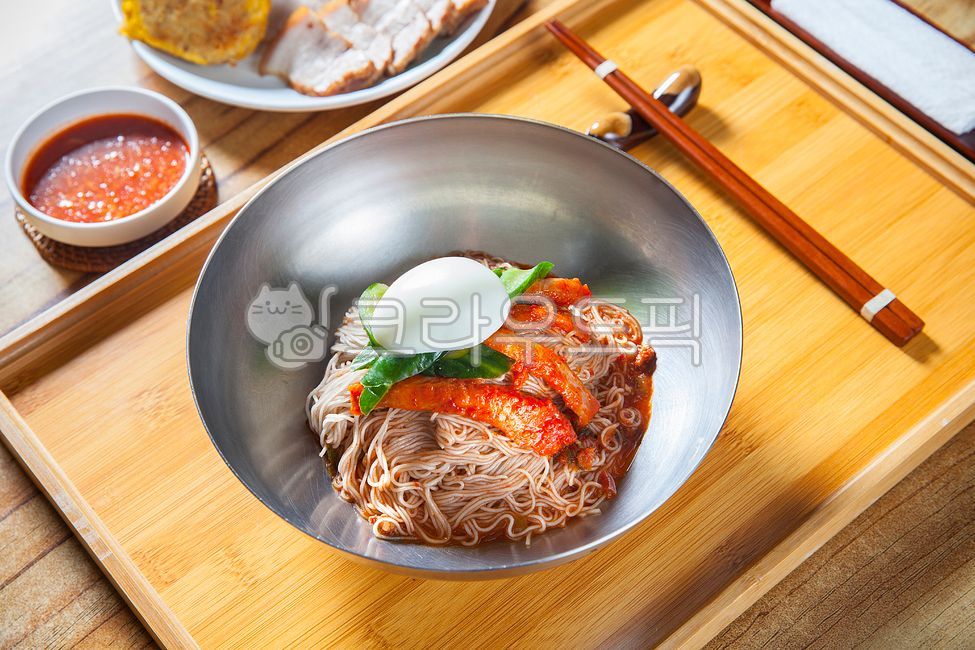 Mulnaengmyeon,tray,egg,cucumber,chopsticks,Bibim Naengmyeon,wooden chopsticks,Traditional menu,beef,noodle,bowl,Cold noodles,bamboo tray,Hamheung Naengmyeon,Bibim Naengmyeon Sauce,Meat Cold Noodles,Hoenaengmyeon,watercress,Beef Cold Noodles,Naengmyeonsari