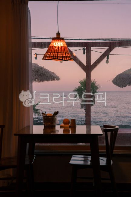 chair,restaurant,jeju island,sunet,jejudo,ocean,furniture,light,sunset,beach,wood