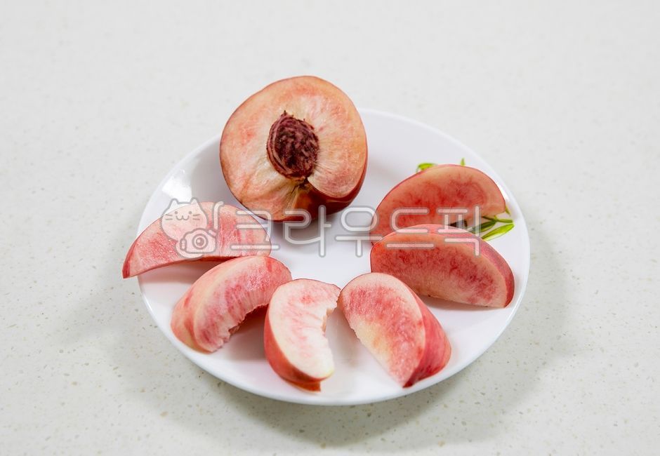 peach,peach,fruit,hard,summerfruit,food,red,yummy,sweet,peach,fruit,food,plate,bowl,seed,peachseed,cross section