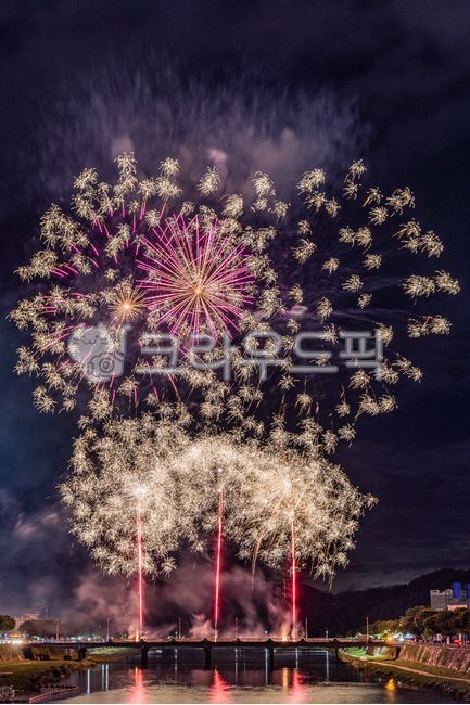 fireworks,water,building,urban,waterfront,cityscape,flame,architecture
