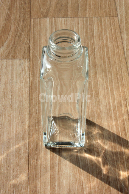 glass,wooden floor,empty bottle,glass bottle,recycling,opened,bottle,clean,empty,square,open