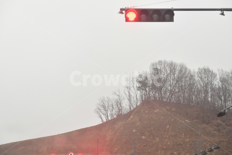 Waiting for the signal,stop,red light,cloudy day,pause