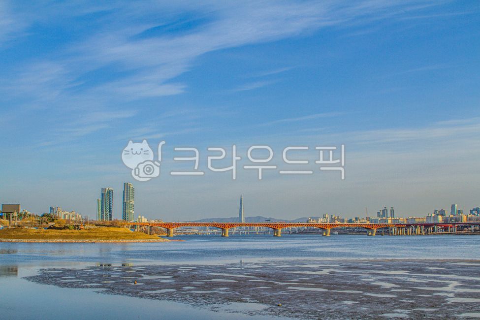 highrise building,Lotte Tower,Gangbyeonbukro,Seongsu Bridge,Yeongdong Bridge,Olympic Boulevard,water,building,Han River,cloud,highrise,Seoul,waterfront,river,bridge,tower