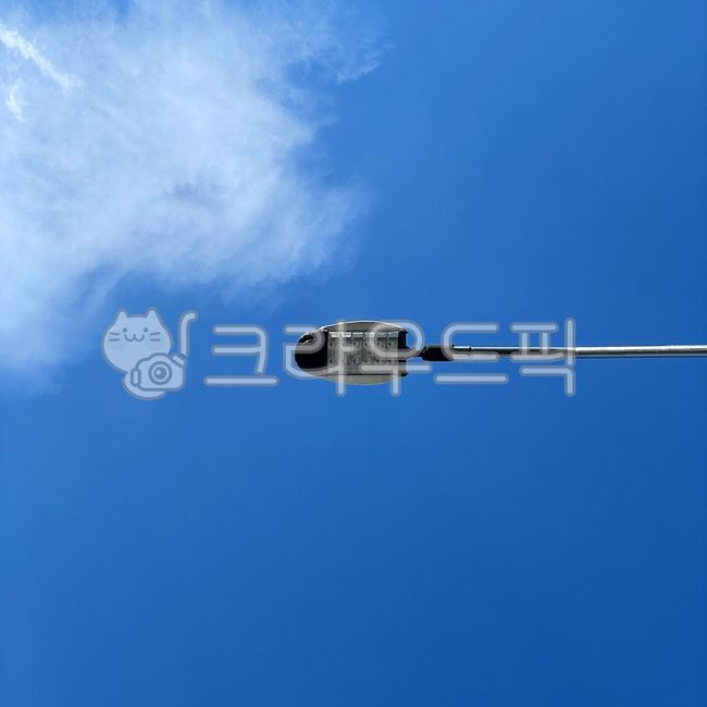 sky,cloud,blue sky,lamppost,lamp post,white clouds,Street lamp