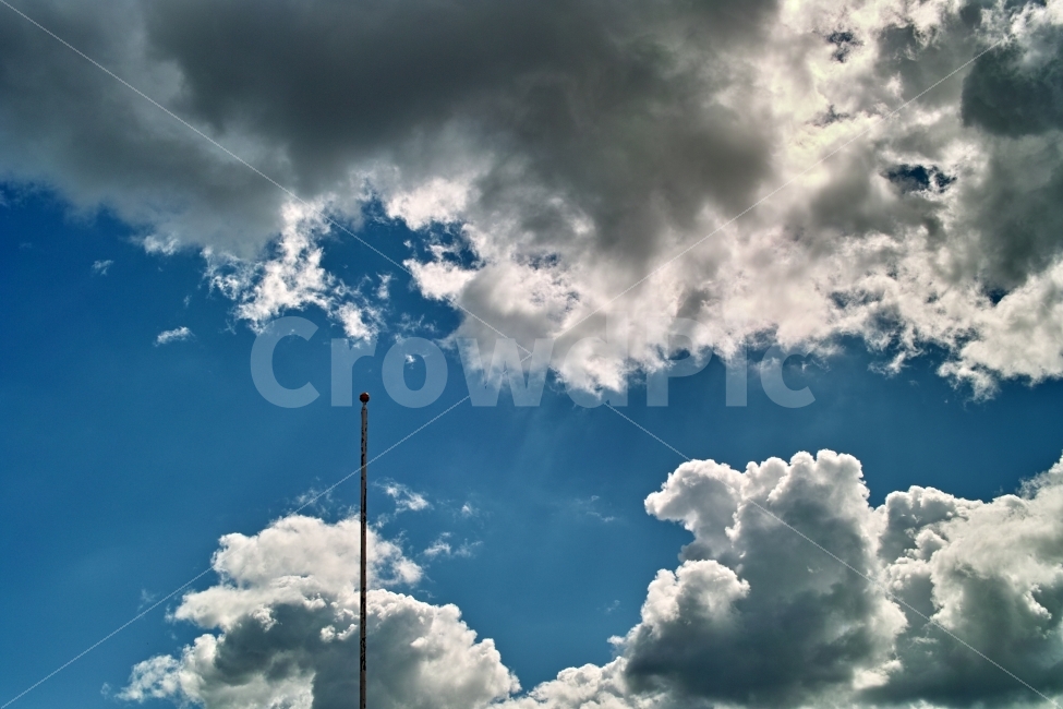 cloud,sky,light between clouds,dark clouds,cloudy sky,clouds,flagpole,cloudy day,Sky of Autumn