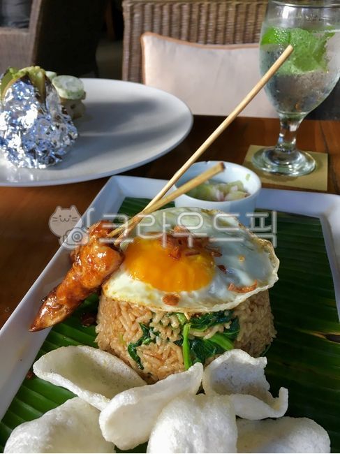 meal,Balinese food,Satay,Bali,Fried egg,fried rice,Nasi Goreng,Shrimp Chips,table,food,glass cup