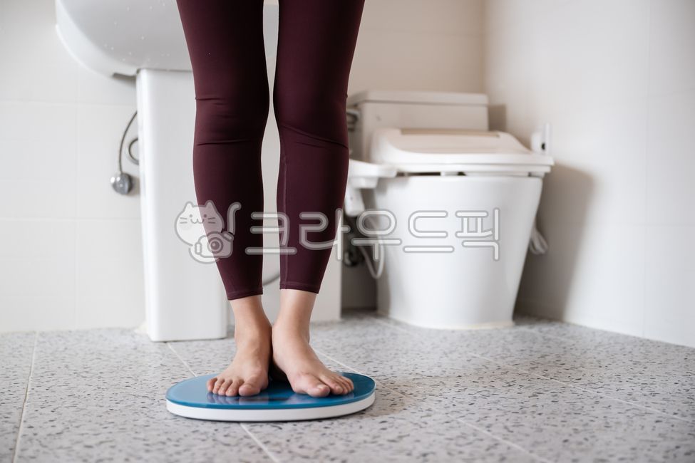 measuring,woman,beauty,front view,slim,scale,measurement,leg,healthcare,shower room,balance,fitness,barefoot,wellness,diet,female,leggings,bathroom,foot,sink,weight management,weight loss,health,weight,calories,Weight,standing,toilet,management,person,med
