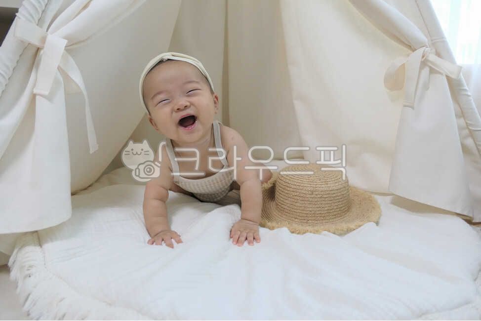 small,basket,0 years old,rug,playroom,Indian tent,infant,smile,son,angelic,cradle,look,baby tent hat,nursery,hair band,person,infant tent,Embraced,laughter,tent,young,mothers arms,cute,one year old,eyes,life,interior,child care,cushion,happiness,joy,dolll