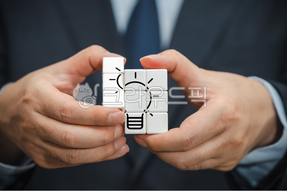 Brainstorming,thought,idea,concept,icon,operator,professional,holding,problem,solution,innovatory,catch,man,hand,innovation,close up,business,manager,assignment,bulb,problem solving,target,marketing,Cube,management,business man,puzzle,success,person,solve