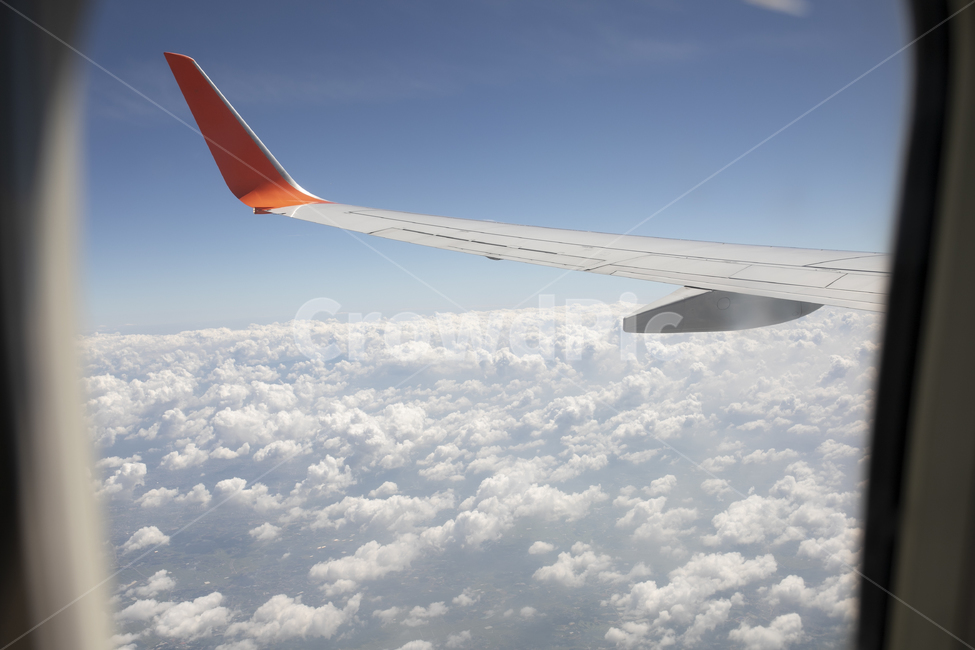 flight,outside the plane,cloud,business trip,trip,Above the sky,vacation,traffic,sky,nature,traveling,outdoor,airplane wings,airplane window,outdoors,airplane,window,travel,wing,landscape